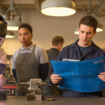 Diverse high school students in a Pennsylvania CTE workshop learning precision welding and fabrication under instructor guidance, with career preparation tools and equipment in the background.